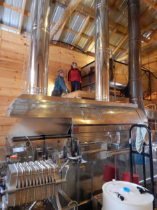 Morgan and John checking the concentrate tank above the evaporator.
